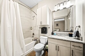 You feel a sense of calm as you enter the bathroom, where the thoughtful design and high-quality materials create a serene environment.