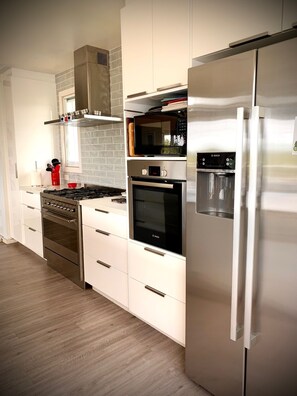 Entertainers dream gourmet kitchen with double ovens, open to main living&dining