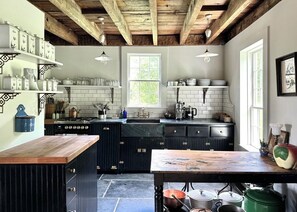 Fully equipped chef's kitchen, antique work table, exposed beams
