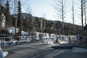 Enjoy the heated outdoor pool and 3 hot tubs