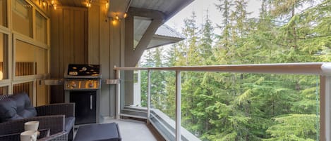 Private Patio with Weber BBQ, outdoor patio furniture and fun festoon lighting.