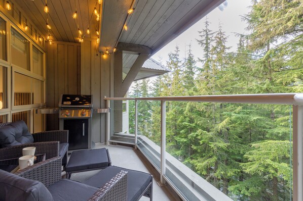 Private Patio with Weber BBQ, outdoor patio furniture and fun festoon lighting.