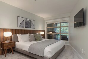 Main Bedroom - King bed with smart TV & cable, closet space and forest views.