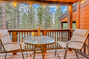 Exterior: Private balcony, bistro lighting, outdoor table with 2 chairs