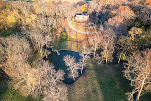 Expansive private property with a serene pond and surrounding trees—ideal for reconnecting with nature and enjoying peaceful views.