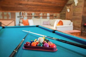 Head upstairs for some fun in the game room! This cozy loft features a full-size pool table and comfy seating, making it the ideal space for entertainment and relaxation.