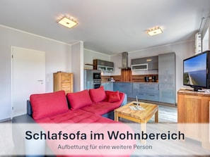 Gemütliches Schlafsofa im Wohnzimmer für 1 Person.