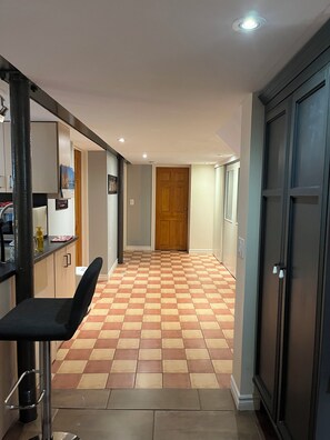 Hallway to the bedroom and laundry area