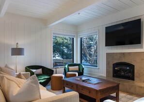 Relax & unwind with a cozy gas fireplace and Smart TV with cable