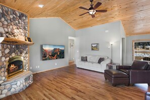 Living room - Open living room with gas fireplace, Smart TV and lots of seating.