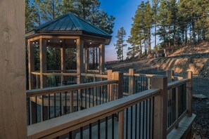 A walkway that feels like a fairytale, ending in a gazebo dream.