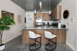 Craft tasty dishes in this contemporary kitchen with all the necessary amenities.