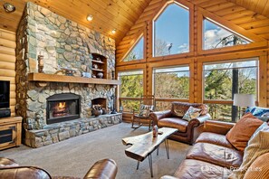 Main level living room with woodburning fireplace