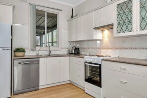  The kitchen comes with everything you’ll need to prepare meals at home, and you’ll find cafes, shops and eateries close by.