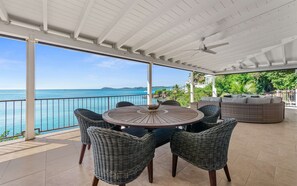 Outdoor dining for six with ocean views