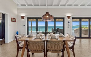 The indoor dining space with seating for six with ocean views