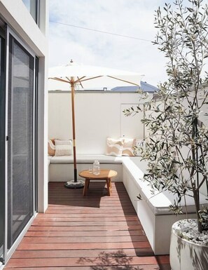 Bask outdoors on your private deck, complete with comfortable seating, a stylish umbrella for shade and a relaxed Palm Springs vibe.