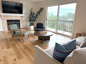 Tasteful common space that can be used for a night lounging with the TV, boardgames, and is adjacent to the dining area.