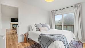 Lovely quaint main floor bedroom equipped with television and queen sized bed. This room offers deck access with sliding glass doors,