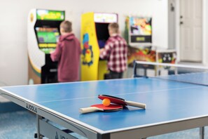 Fun-filled game room with ping pong, Pac-Man, and Golden Tee for hours of entertainment!