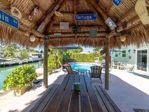 Tiki with picnic table seating.
