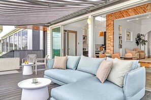 The spacious waterfront deck provides ample seating for relaxed cocktails at sunset.