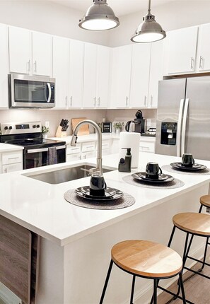 Full kitchen equipped with essentials