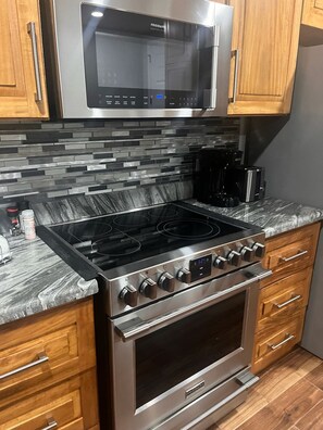 Full size stove and cooktop with built in microwave