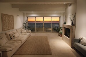 A serene oceanfront retreat with stunning island views at the beach on the sand.