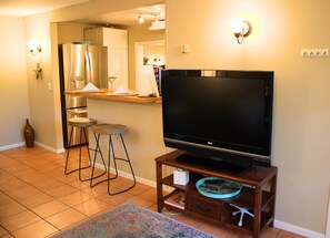 TV and barstool area. All utilities included 