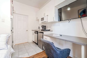 Functional workspace and flatscreen TV, perfect for remote work or relaxing downtime.