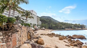 Stay at one of the most iconic beaches in the bay: Playa Gemelas