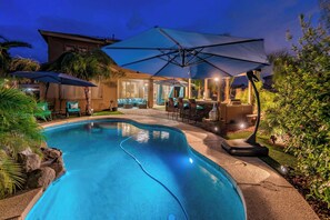 The perfect evening escape—our heated pool glows softly, creating a magical nighttime ambiance."