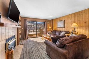 Spacious living room with huge TV