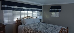 corner view of bedroom, changing to King Feb 2026 after current tenant leaves