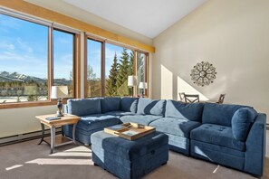 Ample seating to cozy up around the fireplace.