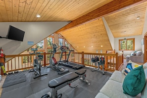 Get Lost Gazing into the Pines while you Stay Fit in the Gym Located in the Loft.