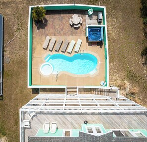 A slice of paradise: Take a dip in the private pool or unwind in the hot tub in the comfort of your own beach house.