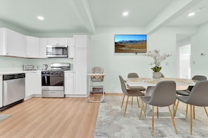 Kitchen, dining area with high chair.
relax and enjoy your family meals.