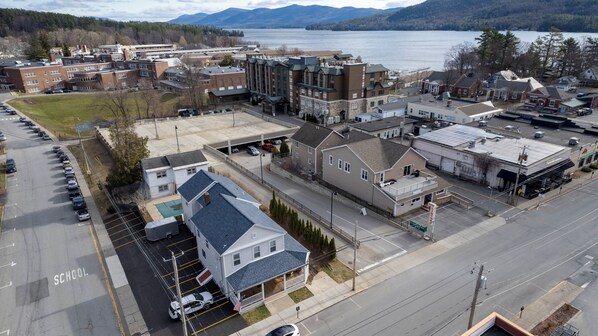 The house with gray roof is our property, one block away from the lake & Beach.