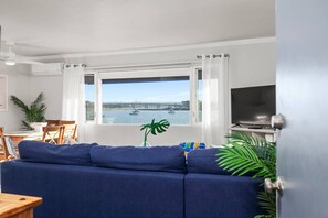 Open floorplan living and dining room with stunning views of mission bay