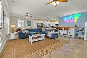 great room with bar, kitchen nook and kitchen