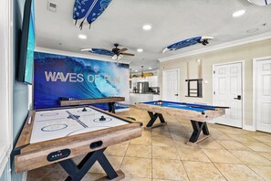 game room with pool, air hockey, shuffleboard, bowling and golf putting 