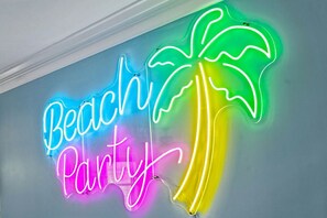 closeup of the neon beach party sign at the bar