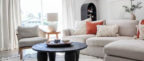Comfortable seating centered around the TV and coffee table, ideal for socializing and unwinding!