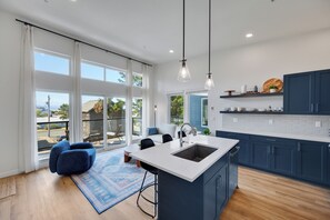 Ample natural light fills the space, completed with window coverings for privacy
