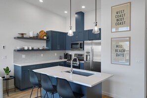 A fully stocked kitchen with everything you need to prepare a home cooked meal. 