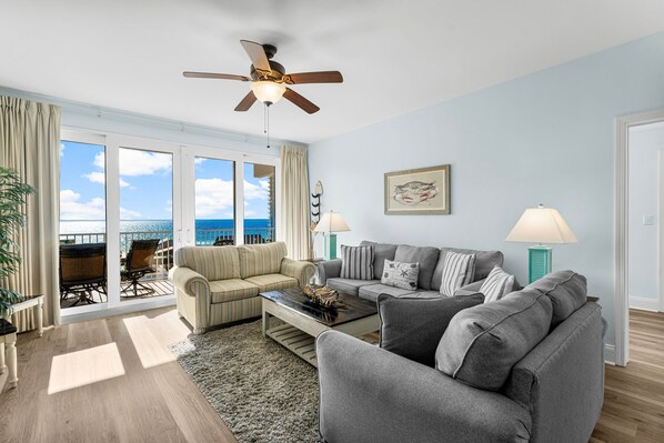 Open Concept Living Area with Sleeper Sofa, Flat Screen TV, Balcony Access and Ocean Views