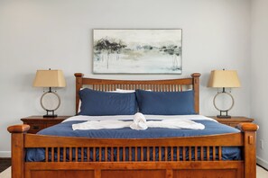 Experience the ultimate relaxation in a queen-size bed designed for serenity.