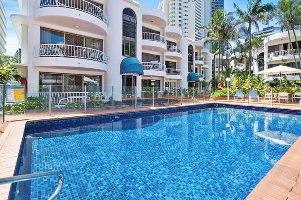 Take a refreshing dip in the sparkling shared pool, set amidst lush greenery and serene architecture.

